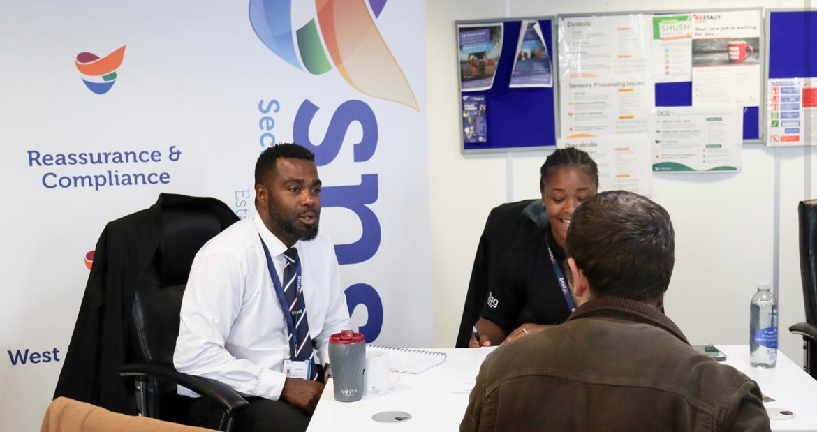 Two of SNSG's senior recruitment team, welcoming an applicant for security jobs in Birmingham, West Midlands and across the UK.